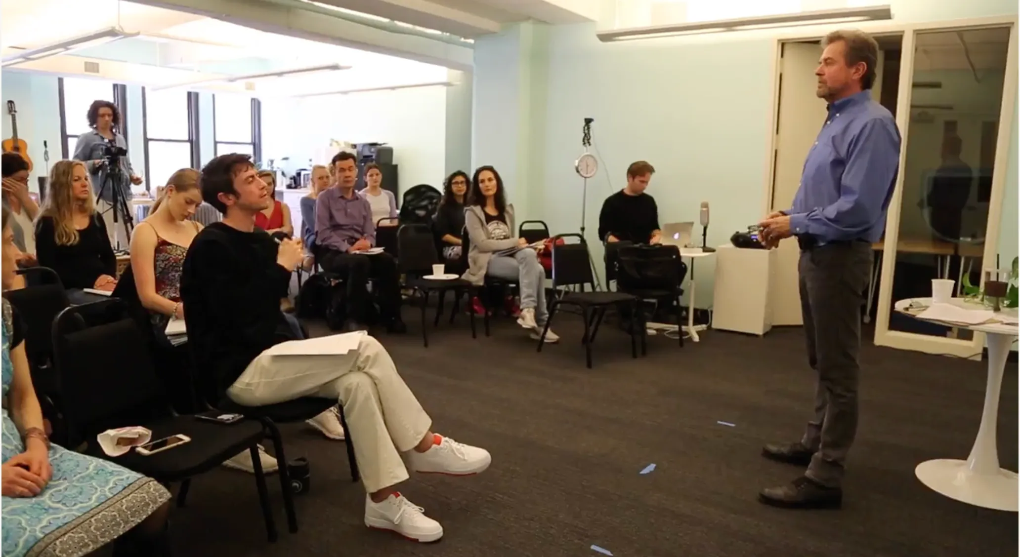A Paradox Process class gathered in a warm studio setting